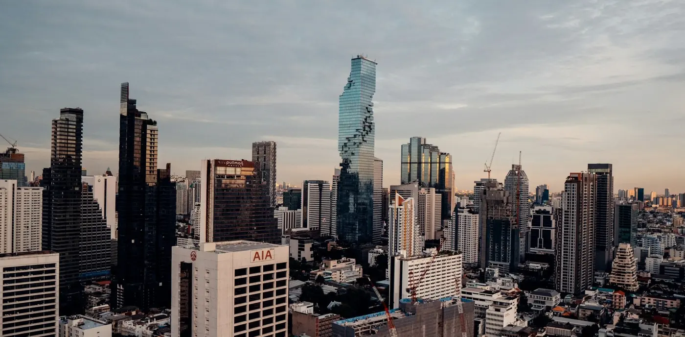 Bangkok’s skyline at dusk, the MahaNakhon tower among the high-rises